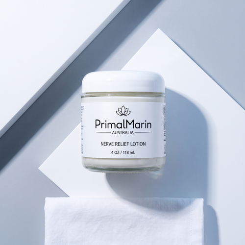 PrimalMarin Nerve Relief Lotion jar in a white and gray flat-lay composition
