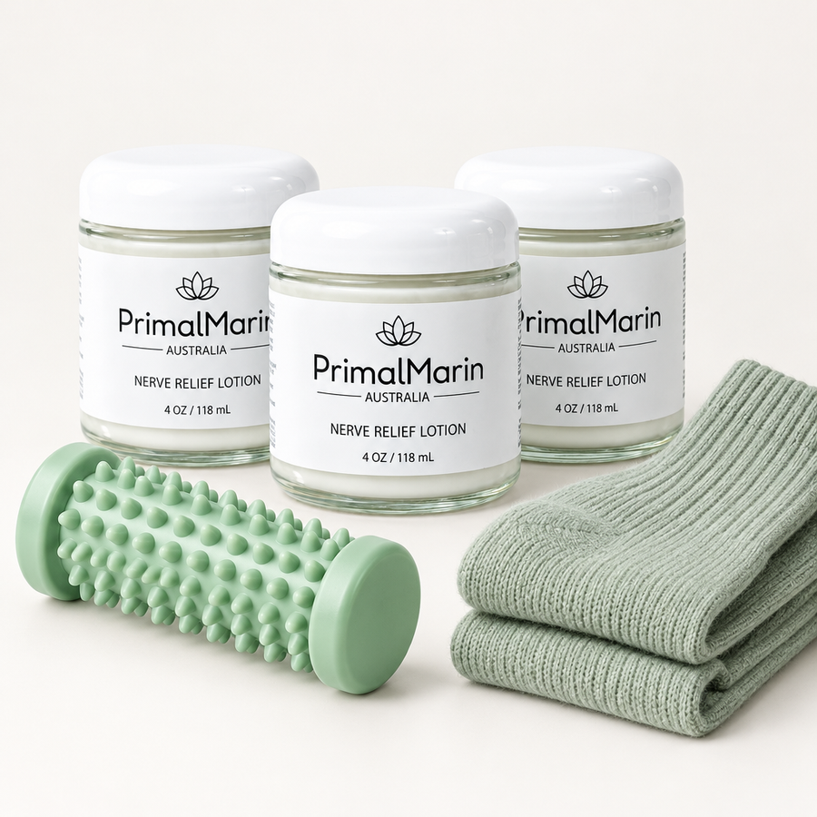 Three PrimalMarin lotion jars with a foot roller and cotton socks